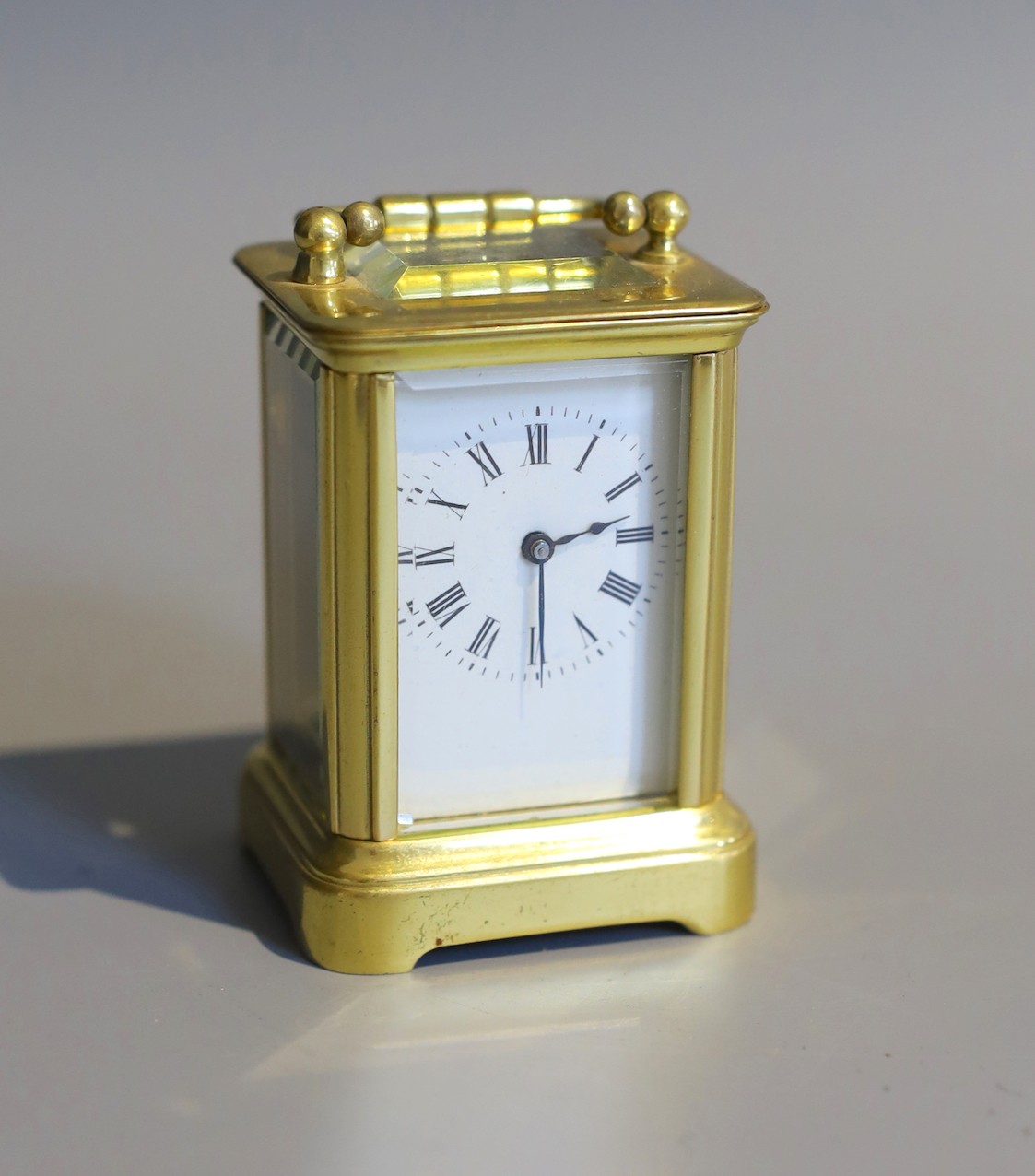 A 19th century French lacquered brass miniature carriage timepiece, height 7cm